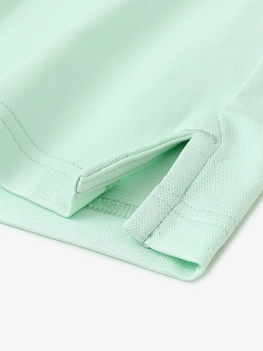 Close-up detail of hem opening on Modern Texture Stylish Polo in MINT GREEN.