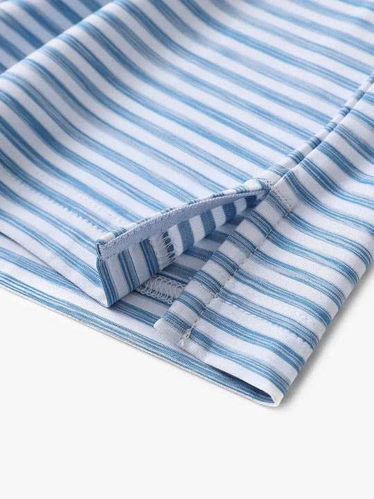 Hem slit detail of SKY BLUE WHITE polo highlighting light brushstroke texture and craftsmanship