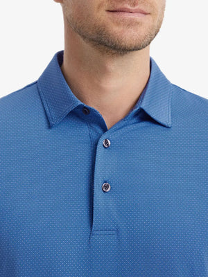 Close-up front shot from nose to chest of model wearing BLUE 4 Way Stretch Jacquard Polo