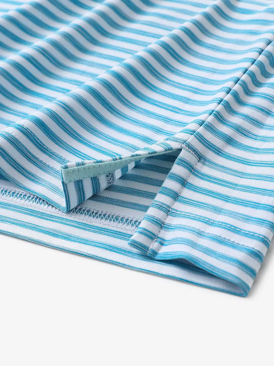 Hem slit close-up of BLUEBIRD WHITE Unique Watercolour Stripe Polo with soft artistic finish