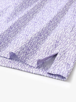 Hem slit detail of MAELREG Performance Jersey Print Polo in Purple Wine Glass – comfort & movement