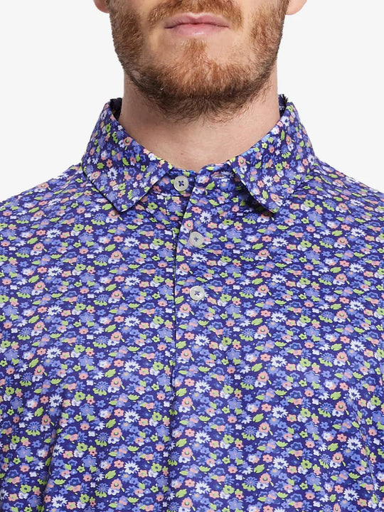 Elegant and sporty in navy blue with a beautiful floral pattern, it's perfect for any golf event.