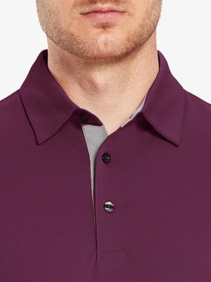 Model wearing the bordeaux red long sleeve pique polo, showcasing its elegant design and comfort.