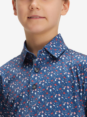 Close-up: nose to chest in american elements performance print boys golf polo