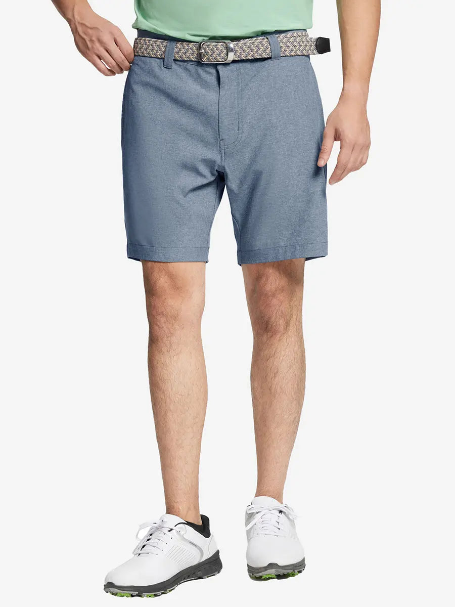 DARK BLUE 7 Inch Heather Performance Golf Shorts with front view, model's lower body and side pockets visible