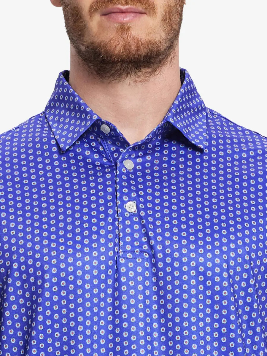 Front half-body view from nose to chest of model wearing BLUE DAISY Performance Quick Dry Print Golf Polo.