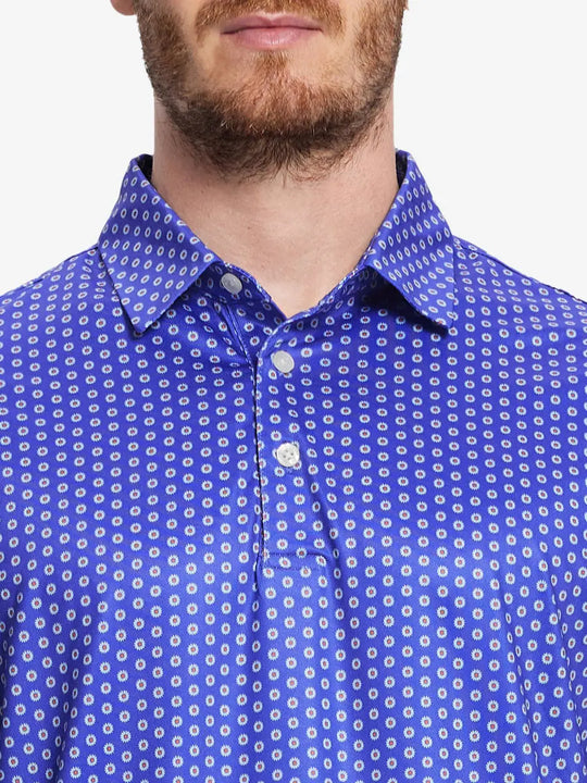 Front half-body view from nose to chest of model wearing BLUE DAISY Performance Quick Dry Print Golf Polo.