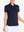 Front view from nose to hem of model wearing NAVY Women's Performance Solid Polo with skirt