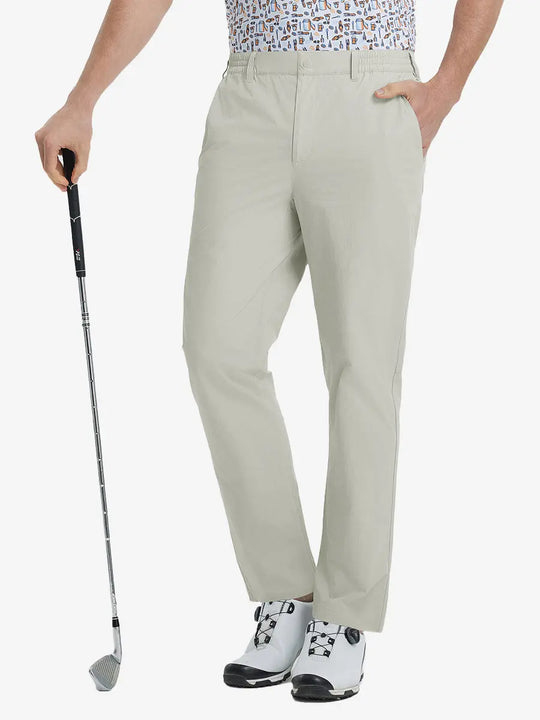 Front lower leg view of Performance Water Resistant Pants in LIGHT KHAKI，model holds golf club in right hand.