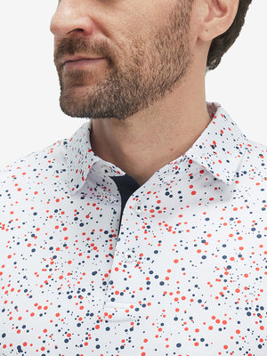 Front view from nose to chest of model wearing the white polka dots 4 way stretch print collared polo shirt, showcasing the upper fit