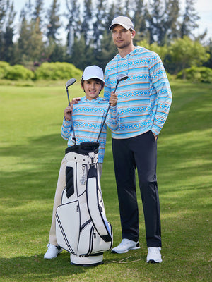 A full-body shot of a model wearing a youth full print stylish hoodie pullover in blue ethnic, with his dad.