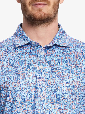 wearing the blue doodles pattern polo shirt, showcasing its modern sporty design and artistic touch