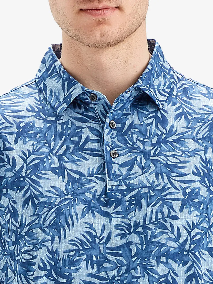 Front half-body view from nose to chest of model wearing BLUE LEAF Performance Quick Dry Print Golf Polo.