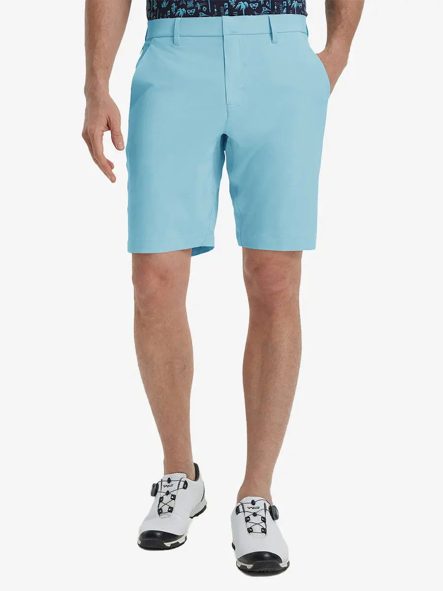 Front view of model’s lower body with hands in pockets, wearing Player Fit Versatile Solid Shorts 9 Inch – LIGHT BLUE