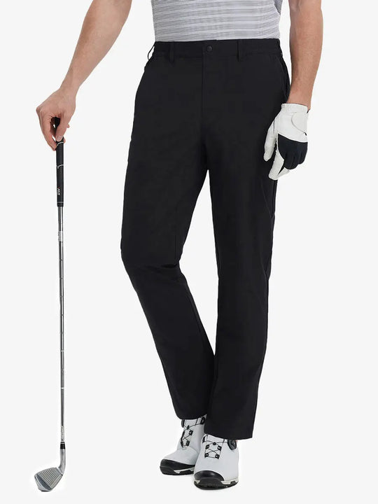 Front lower leg view of Performance Water Resistant Pants in BLACK，model holds golf club in right hand.