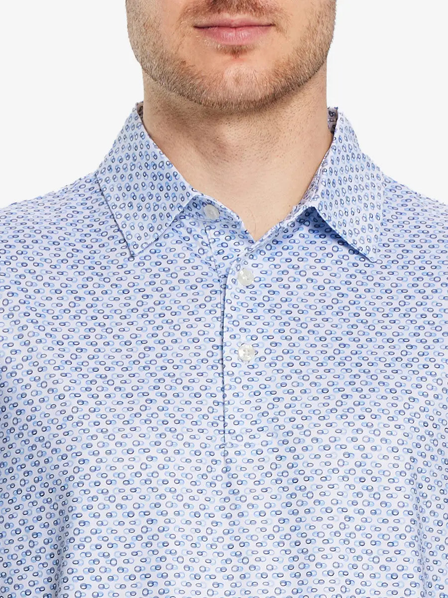 Front half-body view from nose to chest of model wearing BLUE LOOP CHAIN Performance Quick Dry Print Golf Polo.