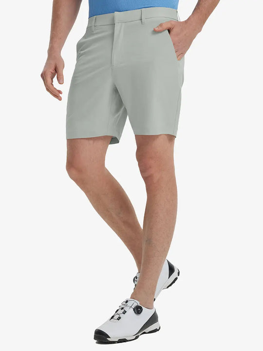 Front view of model’s lower body with hands in pockets, wearing Player Fit Versatile Solid Shorts 7 Inch – NEUTRAL GREY