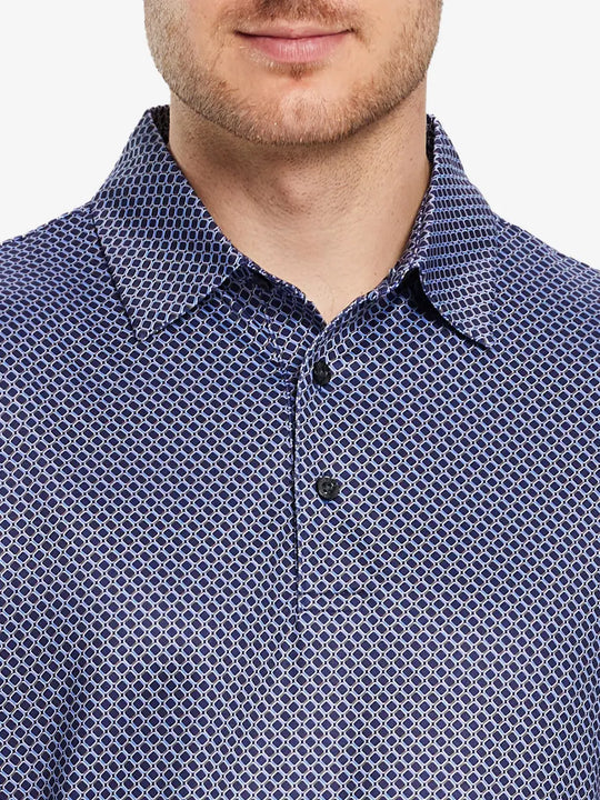 The navy blue color combined with the square geometric pattern is simple and elegant for a classic golf style outfit.