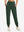 Model wearing women's stretch fleece lined water resistant joggers in forest green, showcasing the front lower body view.