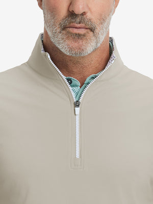 Close-up from nose to chest, showing collar detail and zipper of the khaki light golf vest.