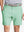 Front view of youth wearing mint green Heather Performance Golf Shorts, showing fit and style