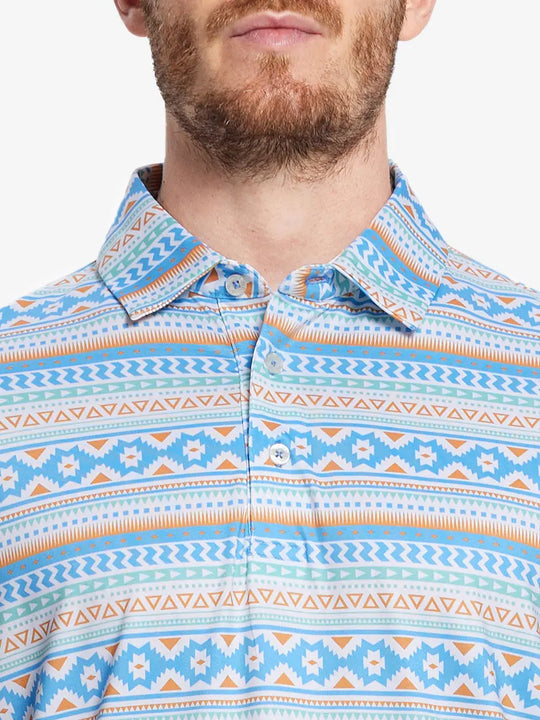 Front half-body view from nose to chest of model wearing BLUE ETHNIC Performance Quick Dry Print Golf Polo.