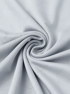 Close-up of light grey modern texture stylish polo fabric showing surface detail.