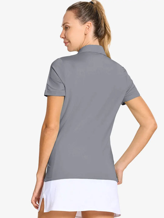 Back-side half-body shot of model in LIGHT GREY Women's Performance Solid Polo, looking over shoulder