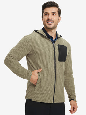 Model with one hand in pocket wearing full zip fleece hoodied jacket in desert yellow, relaxed look.