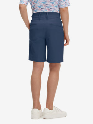 Back lower body in dark blue boys lightweight dry fit flat front golf shorts