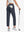 Back lower-body view holding a golf ball with glove in rear pocket wearing NAVY Women's 7/8 Ankle Golf Track Pants.