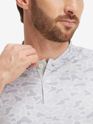 Close-up: nose to chest in brown grey camo stretch printed collarless henley golf shirts
