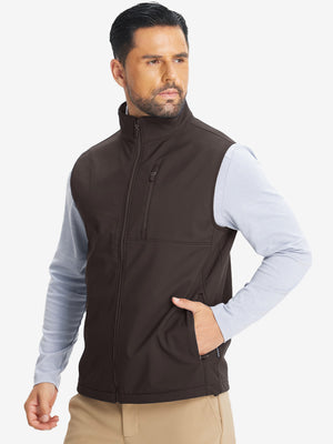 Model front half-body shot with one hand in pocket wearing sleeveless softshell fleece outdoor vests with 6 pockets in coffee brown