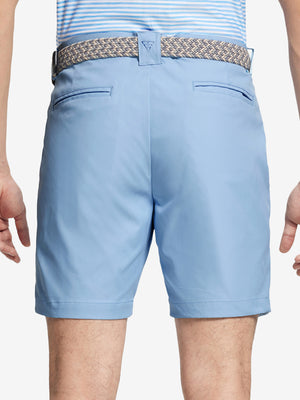 Back waist to knee view of light blue water resistant golf 7 inch shorts, flexible performance fit.