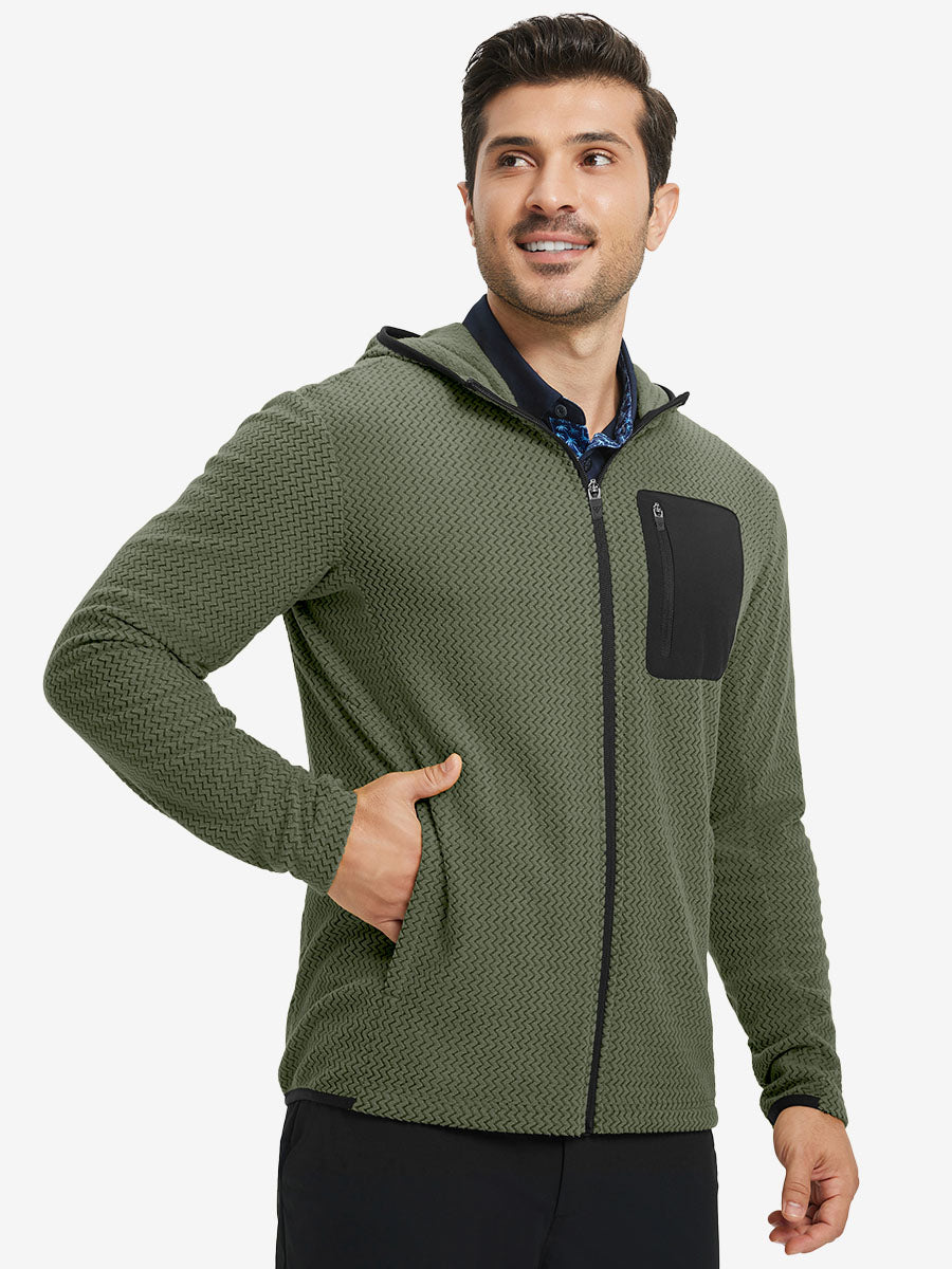 Model with one hand in pocket wearing full zip fleece hoodied jacket in green, relaxed look.