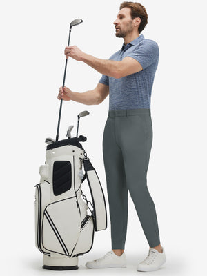 Front full body shot of model wearing dark grey flat front golf joggers pants with belt loops