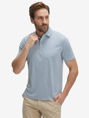 Front waist-up shot of model wearing white light blue grid ultra-light quick dry moisture wicking collared polo shirt