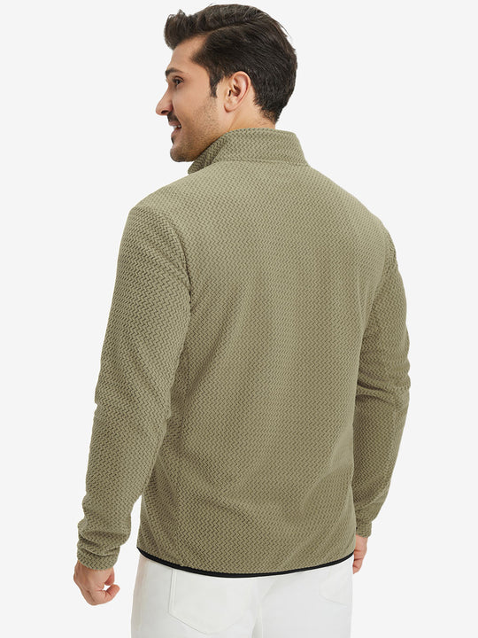 Back upper view of model in midweight warm stretchy quarter zip pullover, highlighting shoulder fit in desert yellow.