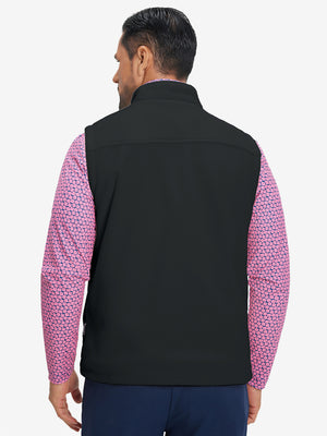 Model's upper body back view wearing black windproof fleece reversible golf vest.