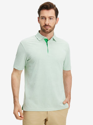 Front half-body view of a model wearing the emerald feather weight jacquard polo shirts, showing the chest pocket