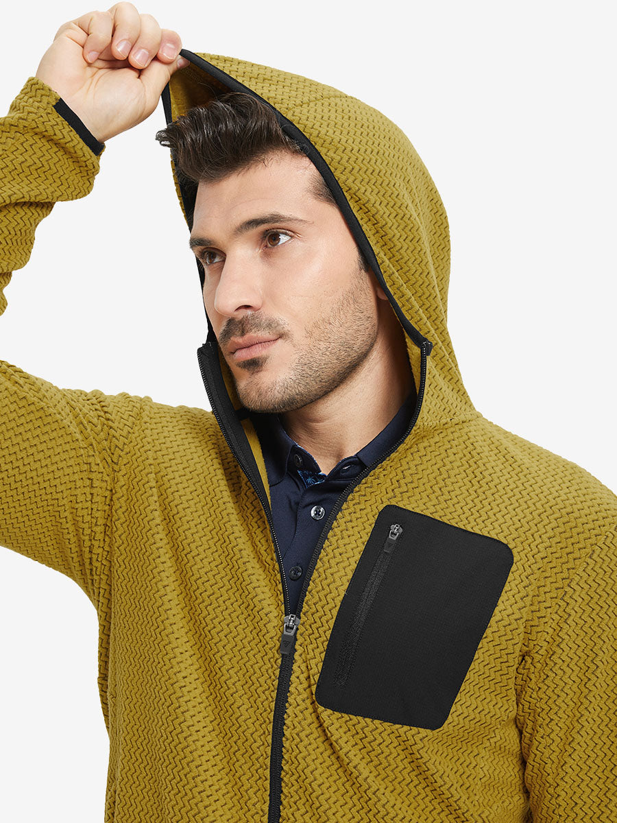 Model wearing hood and pulling it slightly, dressed in full zip fleece hoodied jacket in yellow.