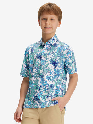 Front half-body of boy in sea turtle performance print boys golf polo