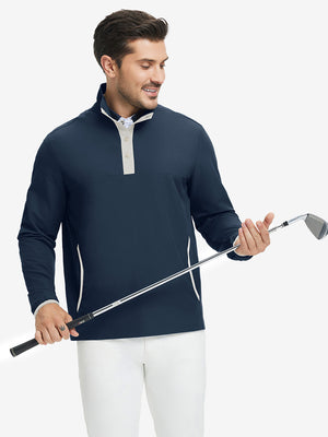 Model holding golf club, wearing mock neck quarter button golf pullover in navy, sporty look.