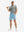 Full-body front view of model wearing the light blue stretch soft flat front dress golf shorts for a complete look