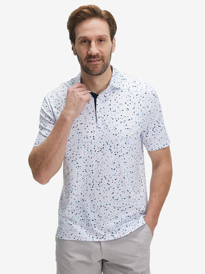 Front half-body shot of model wearing the blue navy dot 4 way stretch print collared polo shirt for a casual sporty look