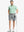 Full body front view of model wearing LIGHT GREY 7 Inch Heather Performance Golf Shorts, holding a golf club