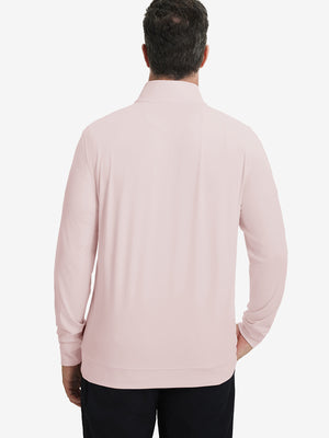 Back upper body view of the light pink lightweight golf pullover, model turns head slightly with ease.