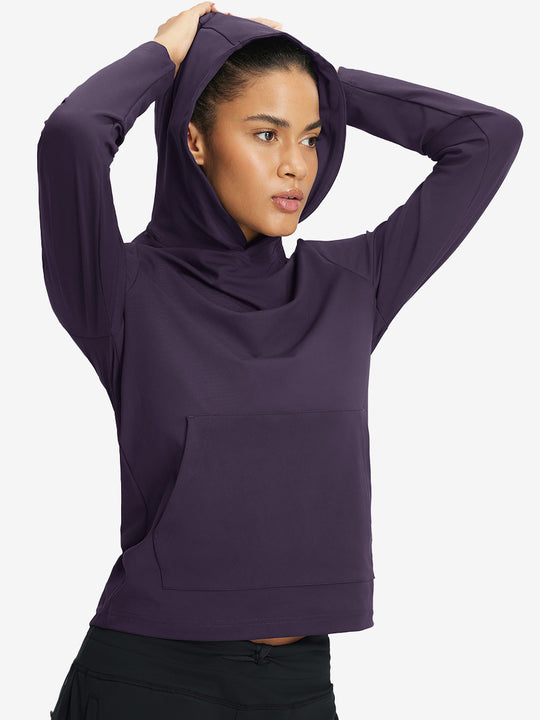 Model holding hoodie cap with both hands, wearing women's lightweight hoodies pullover in dark purple.