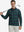 Model holding golf club, wearing lightweight print long sleeve polo in dark plaid, casual sporty fit.