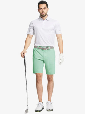 Full body front view of model wearing MINT GREEN 9 Inch Heather Performance Golf Shorts, holding a golf club
